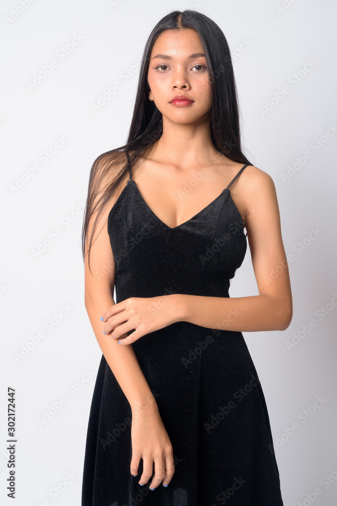 Portrait of young beautiful Asian woman looking at camera Portrait of young beautiful Asian woman looking at camera