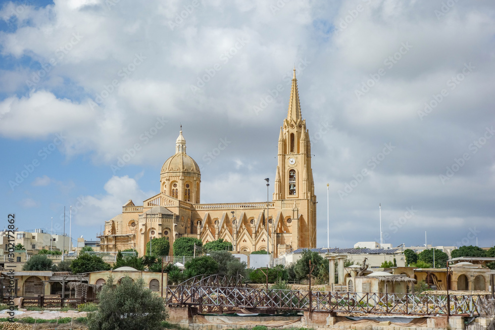 Obraz premium Parish Church of Our Lady of Loreto, Roman Catholic neo-gothic parish church located in the village of Għajnsielem on the island of Gozo, Malta