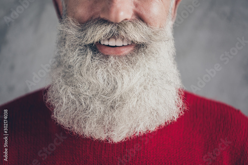 Cropped closeup photo of aged guy with perfect neat groomed long beard after salon procedure wear red knitted pullover cool hipster outfit isolated grey color wall background