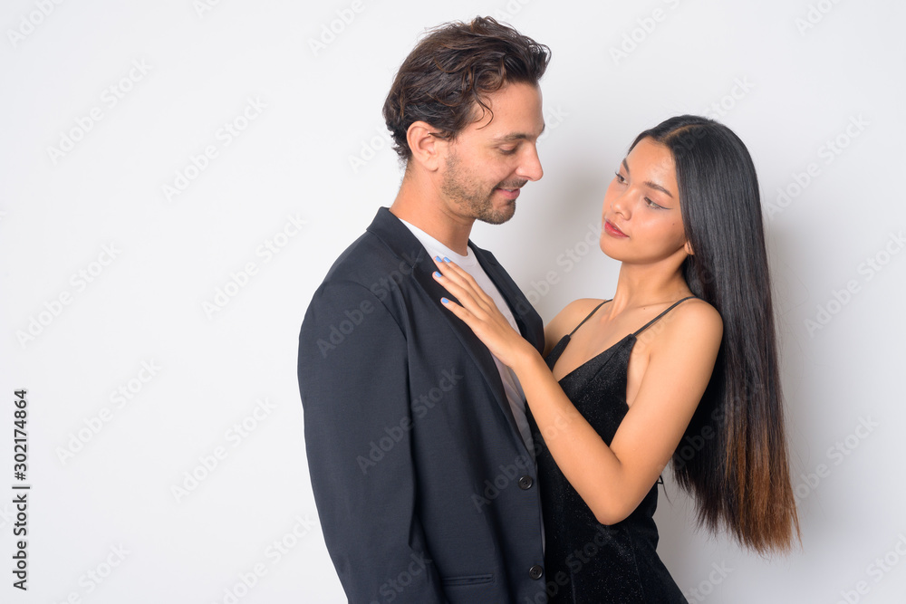 Portrait of multi ethnic business couple facing each other Portrait of multi ethnic business couple facing each other
