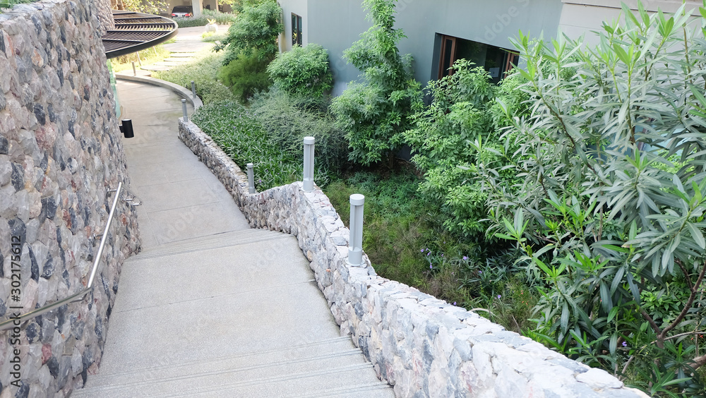 Fototapeta premium Stairway and decorative stone wall