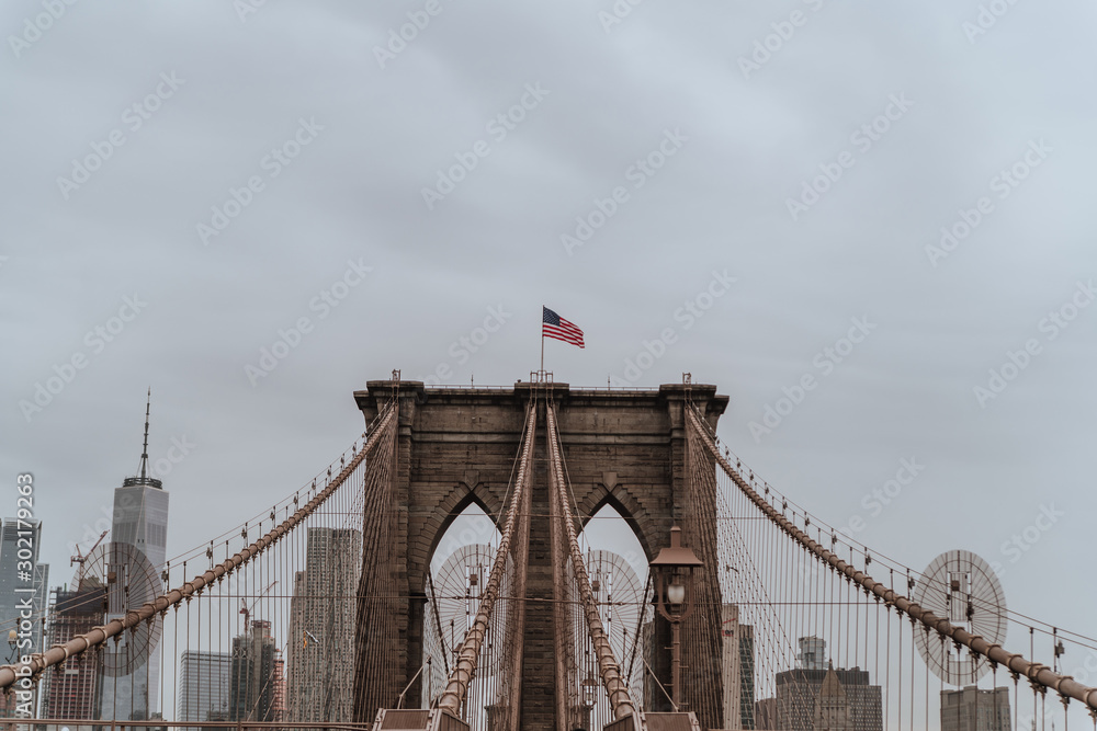 Fototapeta premium Brooklyn Bridge in New York city. Close up brownstone Brooklyn bridge. Manhattan skyline view from the bridge. USA