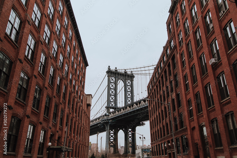 New York, United States of America , Pillar of Manhattan Bridge as seen from an alley in Dumbo district in Brooklyn