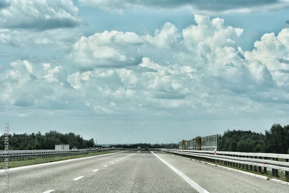 Fototapeta premium Empty highway asphalt road and beautiful sky sunset landscape