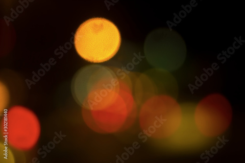 Bokeh with colorful spherical lights alternating with the background image © prasit