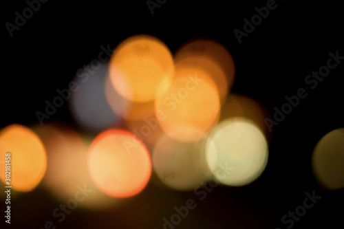 Obraz na plátne Bokeh with colorful spherical lights alternating with the background image