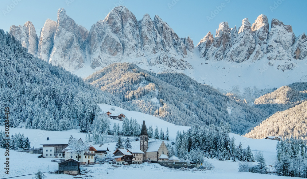 The small village in Dolomites mountains in winter.