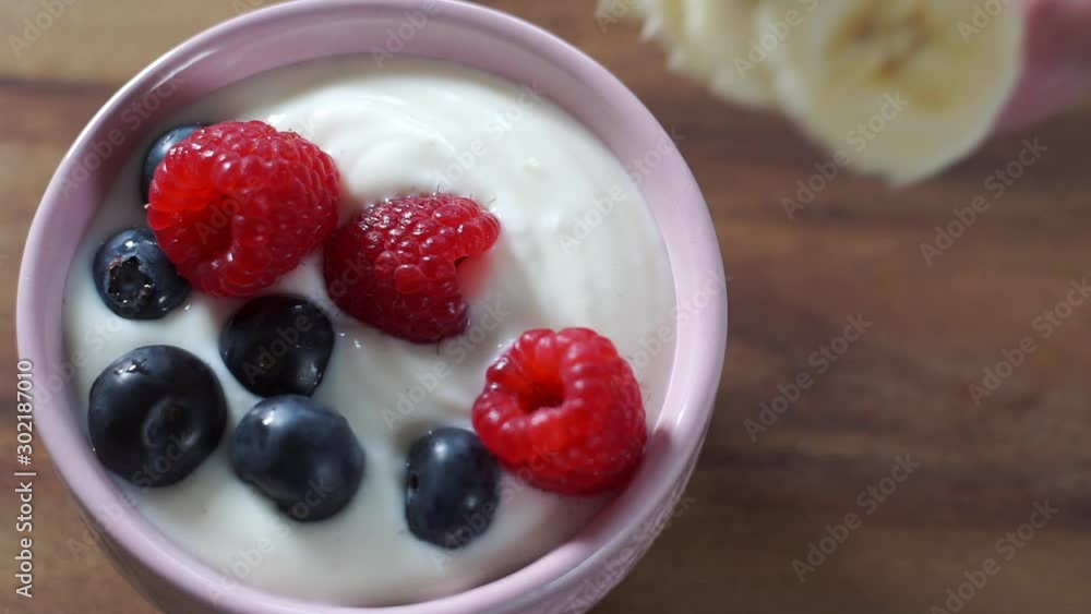 Banana and yogurt raspberry blueberry fruit salad. Healthy eating. Banana and yogurt raspberry blueberry fruit salad. Healthy eating.