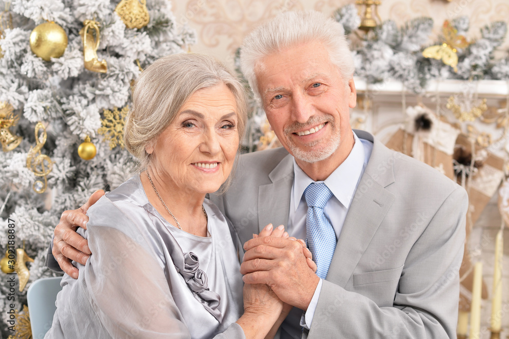 Close up portrait of old couple with Christmas present Close up portrait of old couple with Christmas present