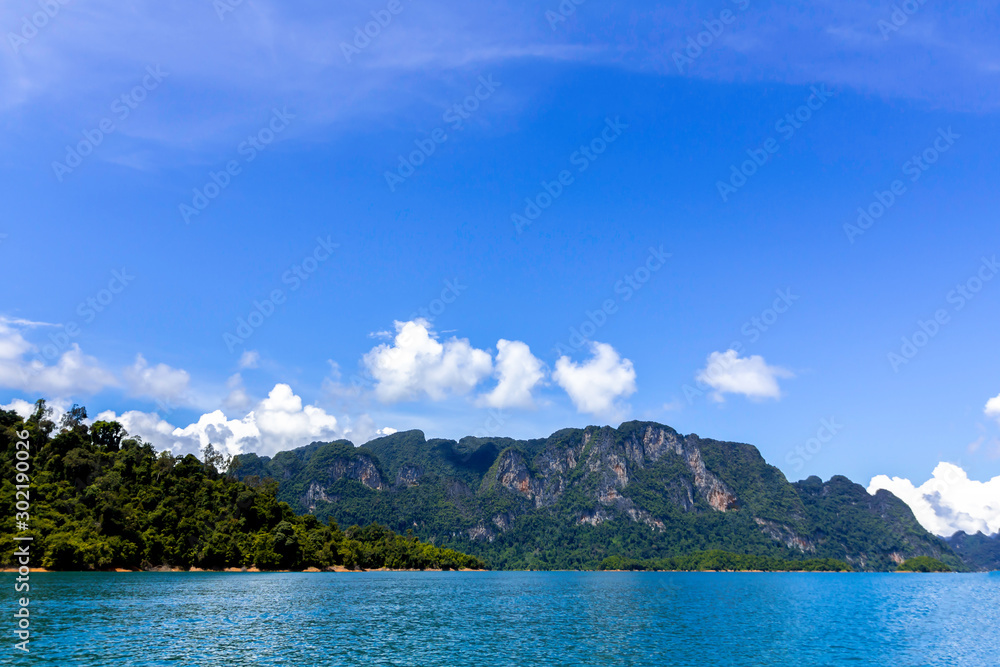 Landscape of mountains with cloud,blue sky and Lake. ratchaprapa dam. suratthani, Thailand