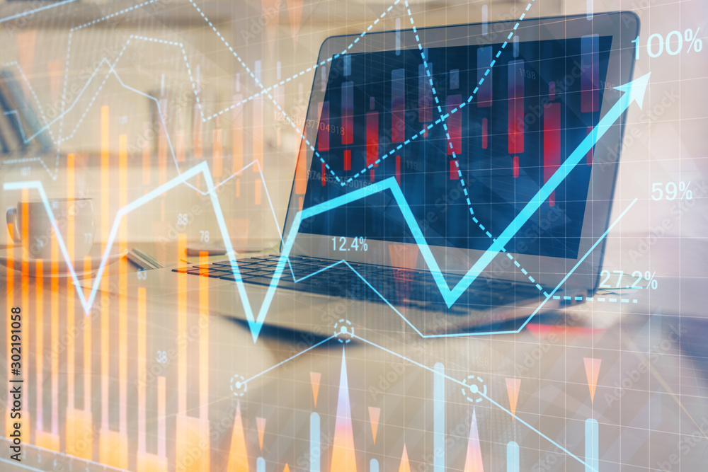 Stock market graph and table with computer background. Double exposure. Concept of financial analysis. Stock market graph and table with computer background. Double exposure. Concept of financial analysis.
