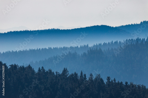 View of mountain ridges separated by aerial perspective..Mountainous countryside of the Moravian-Silesian Beskids range in the Czech Republic, Europe. © Viliam