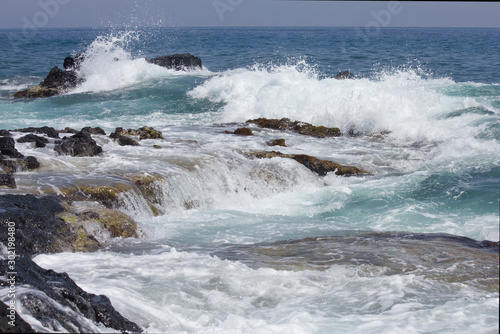 waves crashing on rocks