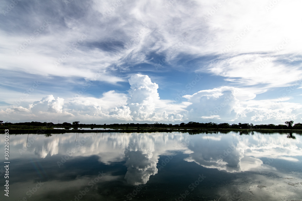 The clouds reflect the water surface during the rainy season in Thailand.