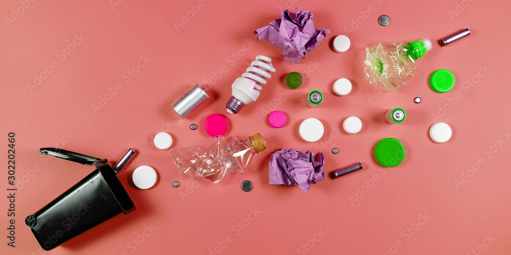 Trash bins and assorted garbage isolated on green, recycle concept, Trash bins and assorted garbage isolated on green, recycle concept,