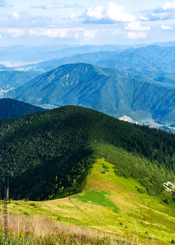 Obraz premium Beautiful view of the mountains and clouds. Natural background and wallpaper. Western Carpathians, Slovakia, Little Fatra.