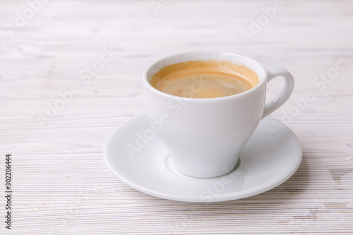 espresso coffee in white Cup white wooden menu background
