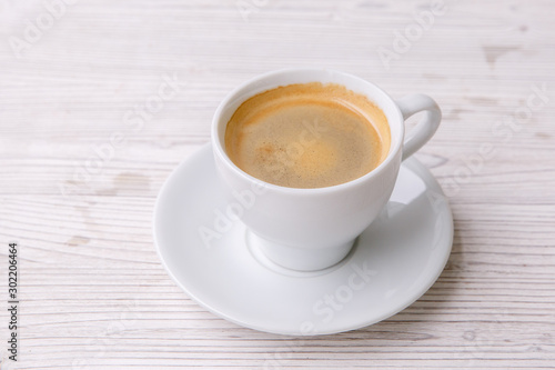 espresso coffee in white Cup white wooden menu background