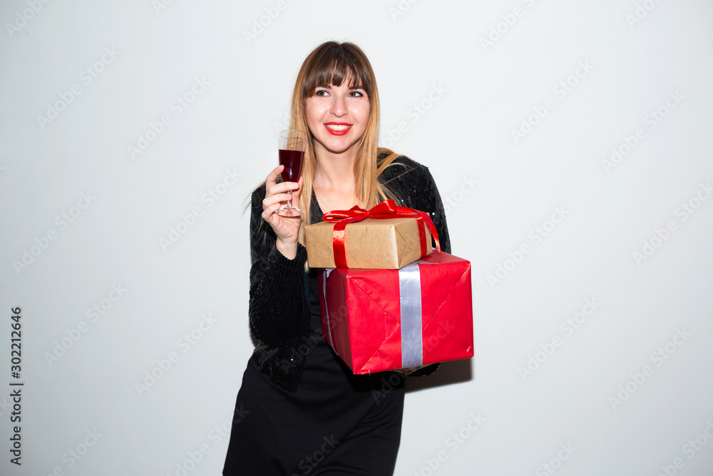 Portrait of a happy smiling girl opening a gift box.happy beautiful woman with many gifts. Beautiful woman hold present. Smiling young woman not isolated portrait Portrait of a happy smiling girl opening a gift box.happy beautiful woman with many gifts. Beautiful woman hold present. Smiling young woman not isolated portrait