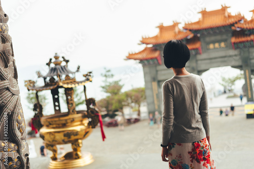 Asian woman stand in the Wenwu temple