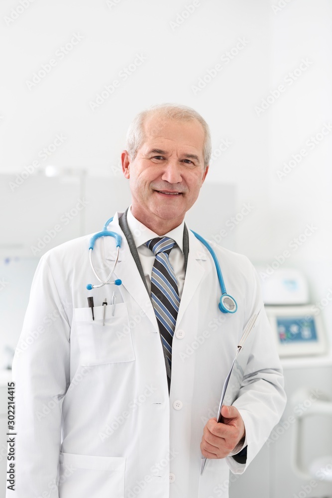 Dentist standing in clinic Dentist standing in clinic