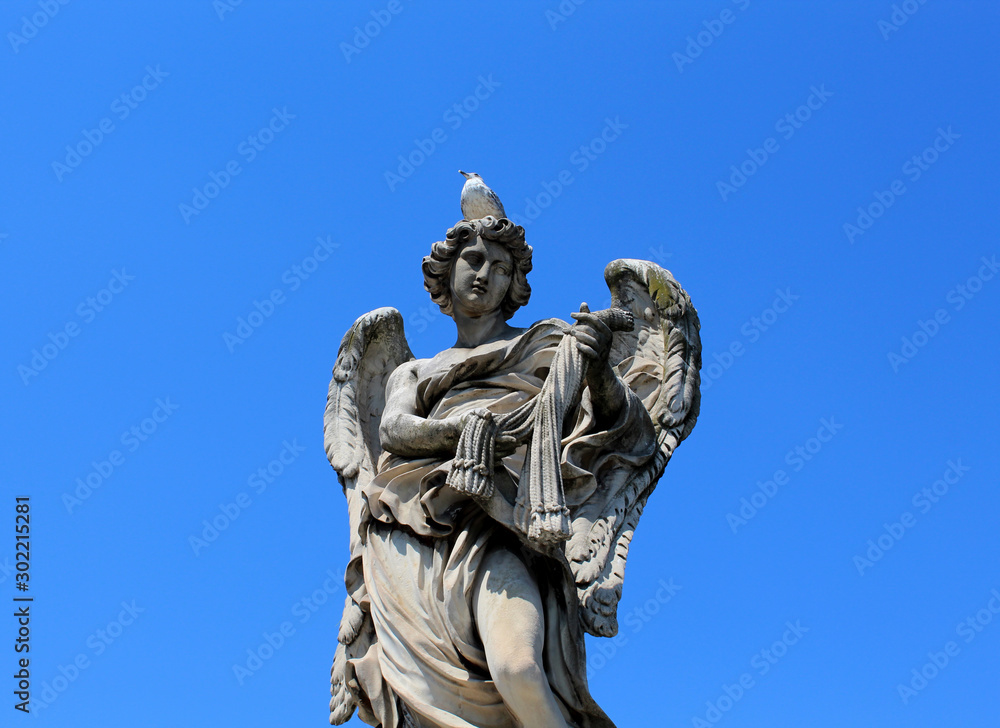 One of the ten angels statue on St. Angel bridge in Rome