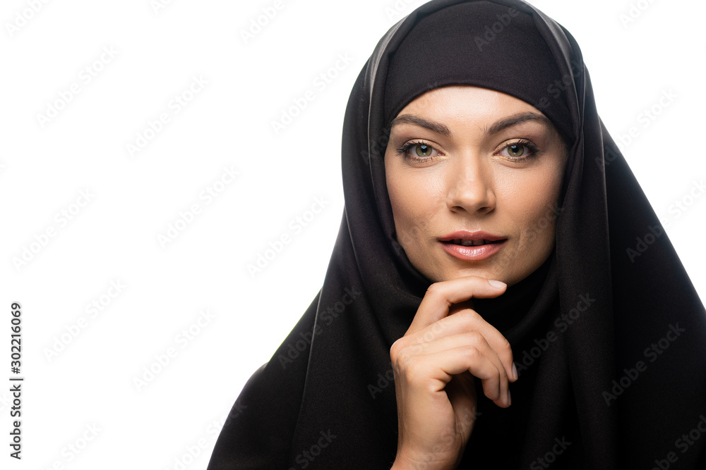 beautiful young Muslim woman in hijab touching chin isolated on white  Stock-Foto | Adobe Stock