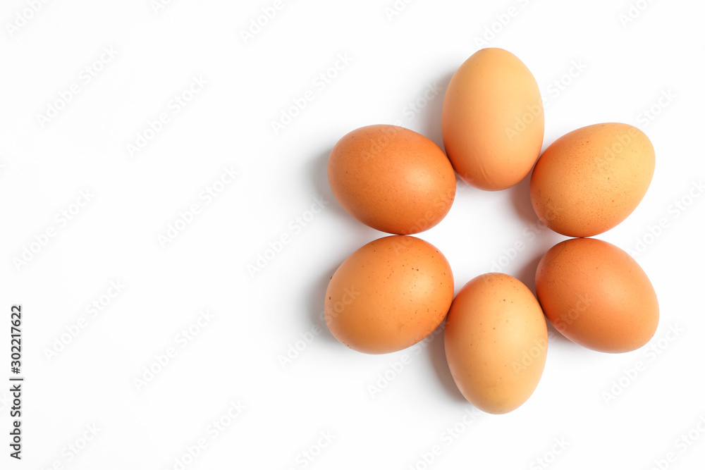 Flat lay composition with chicken eggs on color background, space for text Flat lay composition with chicken eggs on color background, space for text
