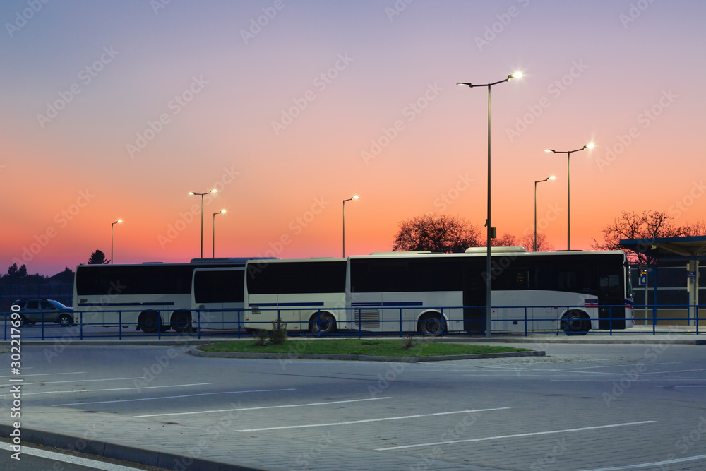 modern small bus station in the evening light with modern Led streetlights
