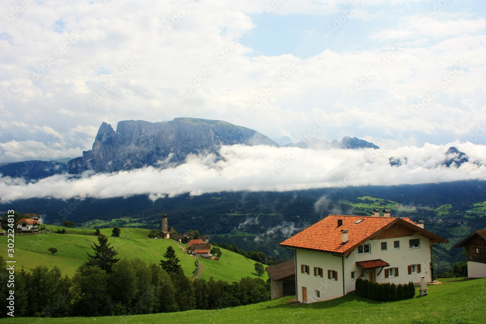 Houses on the slopes of the Dolomites
