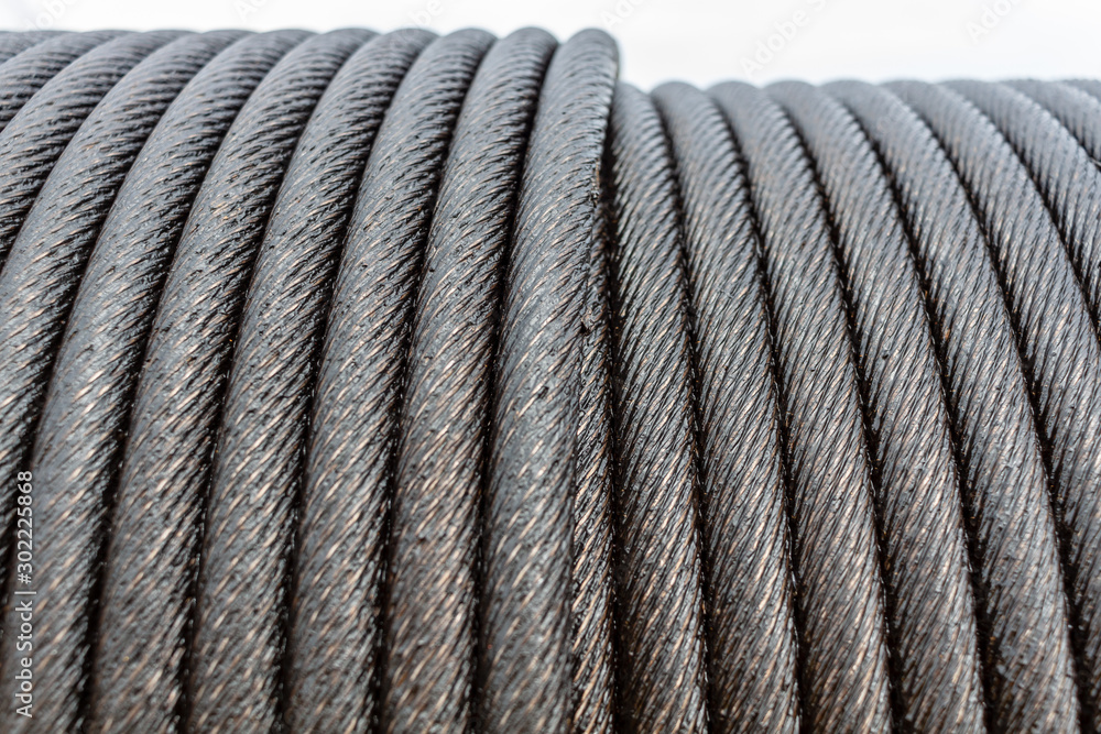 Wire rope sling or cable sling on crane reel drum or winch roll of crane the lifting machine in heavy industrial Wire rope sling or cable sling on crane reel drum or winch roll of crane the lifting machine in heavy industrial