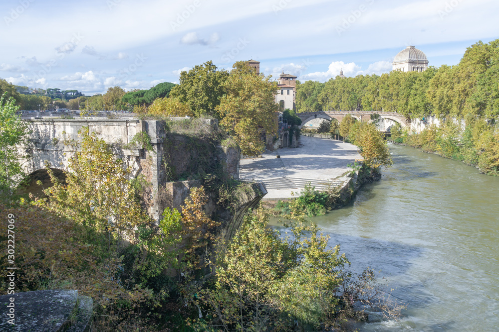 View of the Tiber Island and The Pons Aemilius (Ponte Emilio), today called Ponte Rotto , Rome Italy