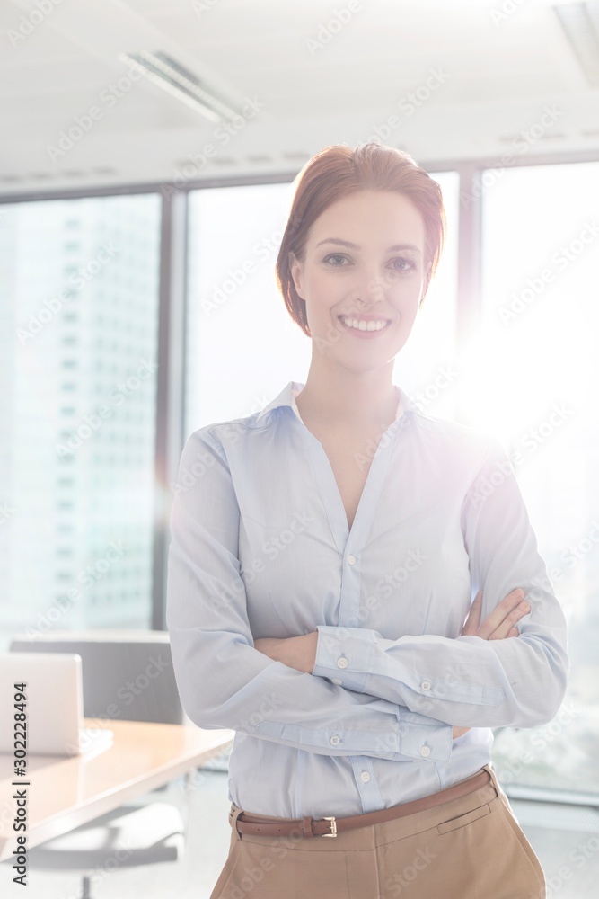 Businesswoman standing in office Businesswoman standing in office