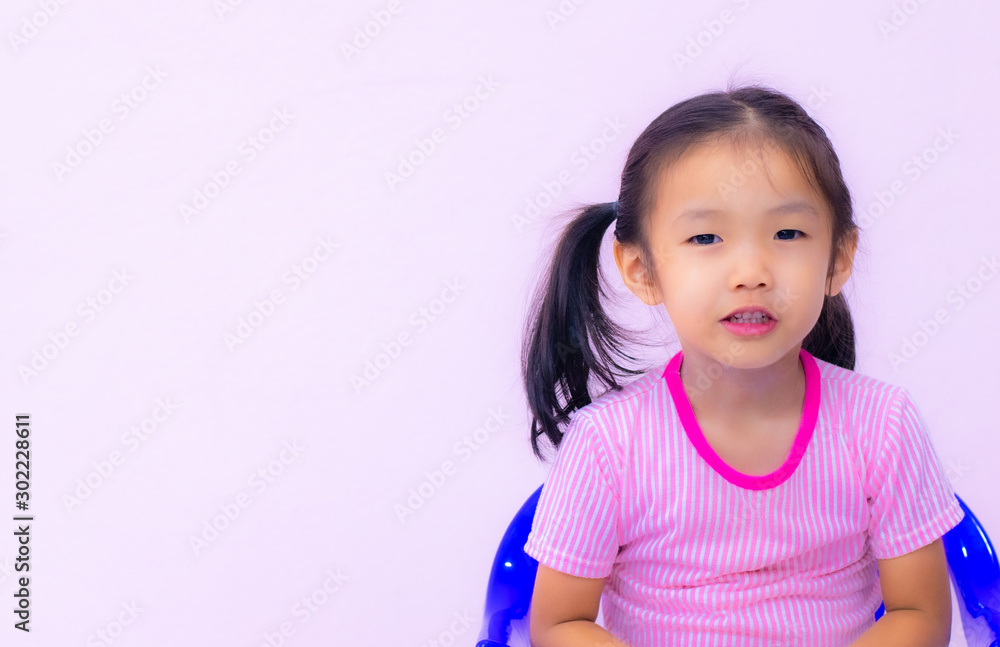 an Asian Kindergarten children in Asia play joyfully on the blue chair an Asian Kindergarten children in Asia play joyfully on the blue chair