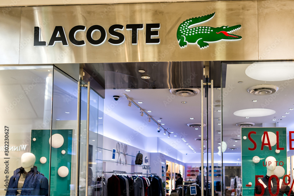 bemærkede ikke røre ved krans Tysons, USA - January 26, 2018: Lacoste store sign entrance shop alligator  logo in Tyson's Corner Mall in Fairfax, Virginia by Mclean Stock Photo |  Adobe Stock