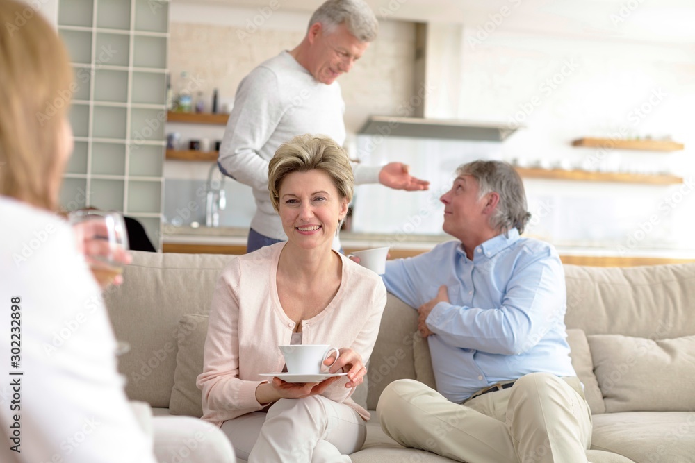 Mature friends enjoying at home Mature friends enjoying at home