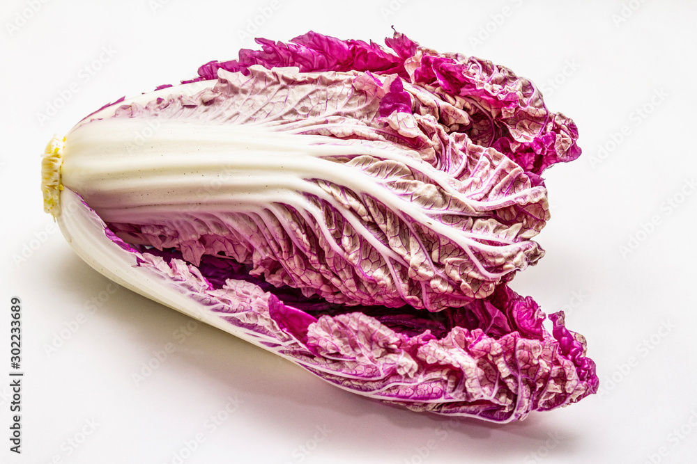 Obraz premium Ripe single purple Napa (chinese) cabbage. Fresh whole head of cabbage. Isolated on white background