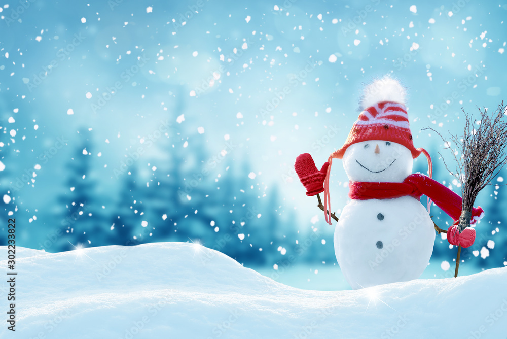 Happy  snowman standing in christmas landscape.Snow background.Winter fairytale.Merry christmas and happy new year greeting card with copy-space.