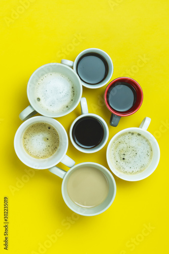 Assortment of Coffee Cups with Coffee Espresso Capuccino Coffee with Milk on a Yellow Paper Background Flat Lay Top View Horizontal