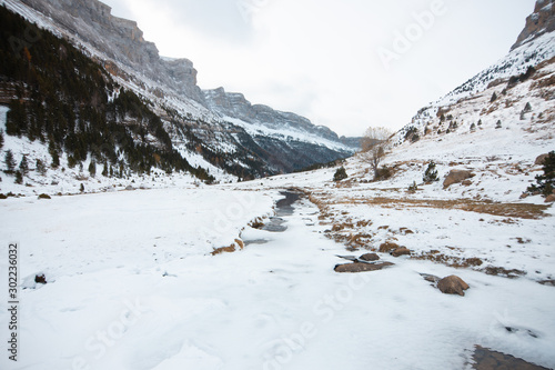 Ordesa National Valley in snowy autumn, located in Pyrenees Spain © robcartorres