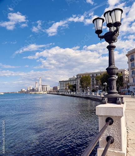 Panorama of the Italian city of Bari, promenade, lights, observation wheel, spring. Traveling in Italy, tourism