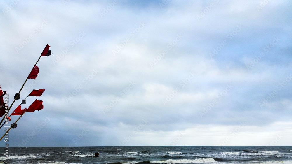Fototapeta premium fishing marker flags on the beach