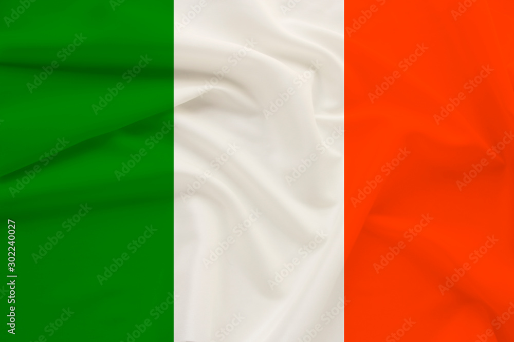 national flag of the country ireland on delicate silk with wind folds, travel concept, immigration, politics, copy space, close-up