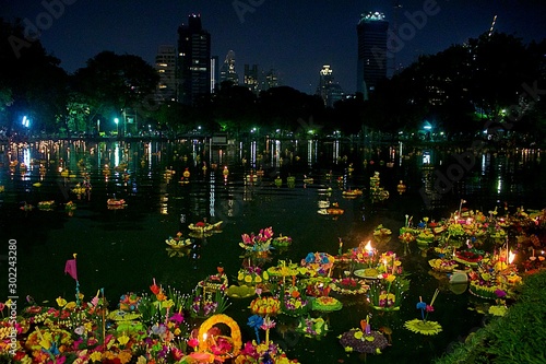 Bangkok, Thailand, November 11, 2019. Loy Krathong festival. Offerings made by Thai people floating in the lagoon in Lumpini Park photo