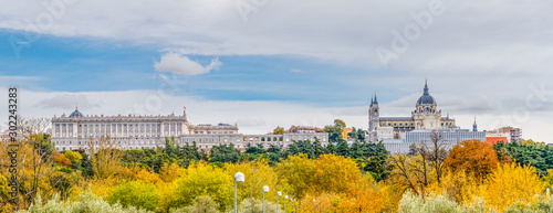 фотографія Royal Palace and Almudena Cathedral with trees with autumn color in Madrid