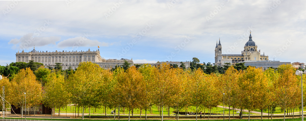 Royal Palace and Almudena Cathedral with trees with autumn color in Madrid