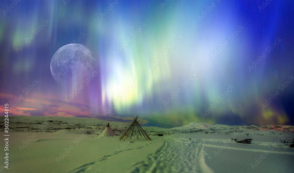 Northern lights (Aurora borealis) in the sky with super full moon