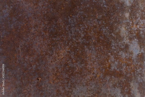 Metal sheet subjected to a corrosion process from the effects of time and weather. Vintage industrial texture