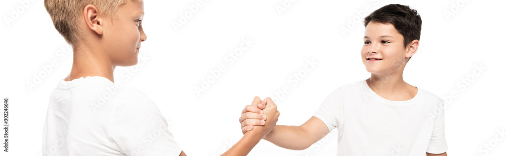 panoramic shot of smiling brothers holding hands isolated on white panoramic shot of smiling brothers holding hands isolated on white