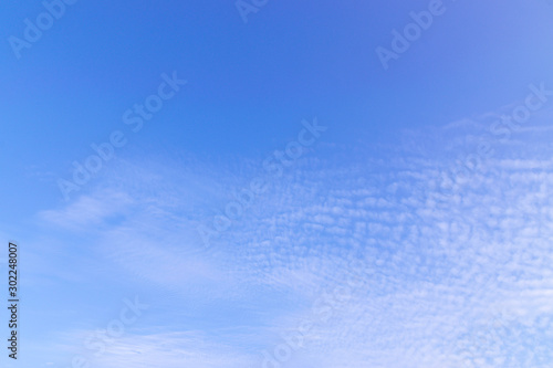 Blue sky with soft white cloudy atmosphere is clear and clean.